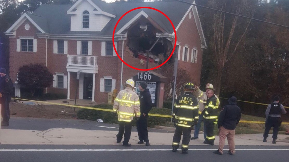 The building, which houses several businesses, was unoccupied at the time of the crash, police said.
