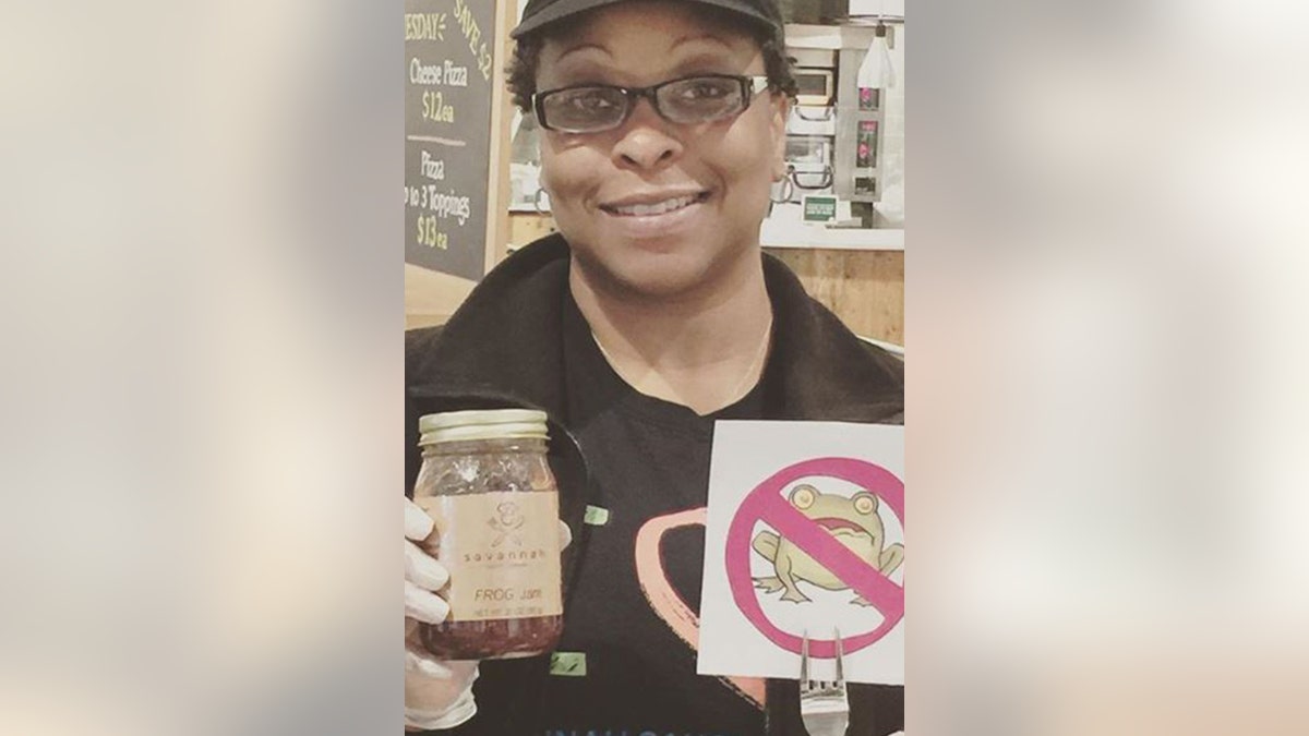 Richburg posing with one of her famous Savannah Sauce Company products, which are all-natural and free of preservatives.