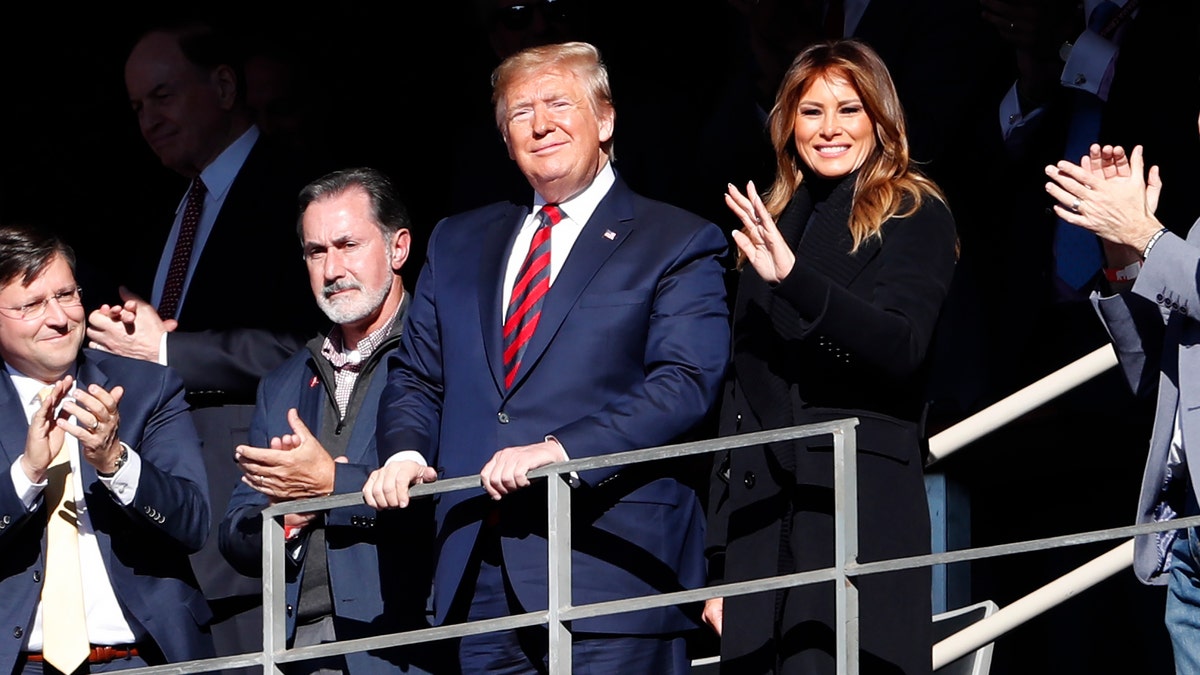 President Donald Trump is introduced to the crowd at Bryant-Denny Stadium. (AP Photo/John Bazemore)