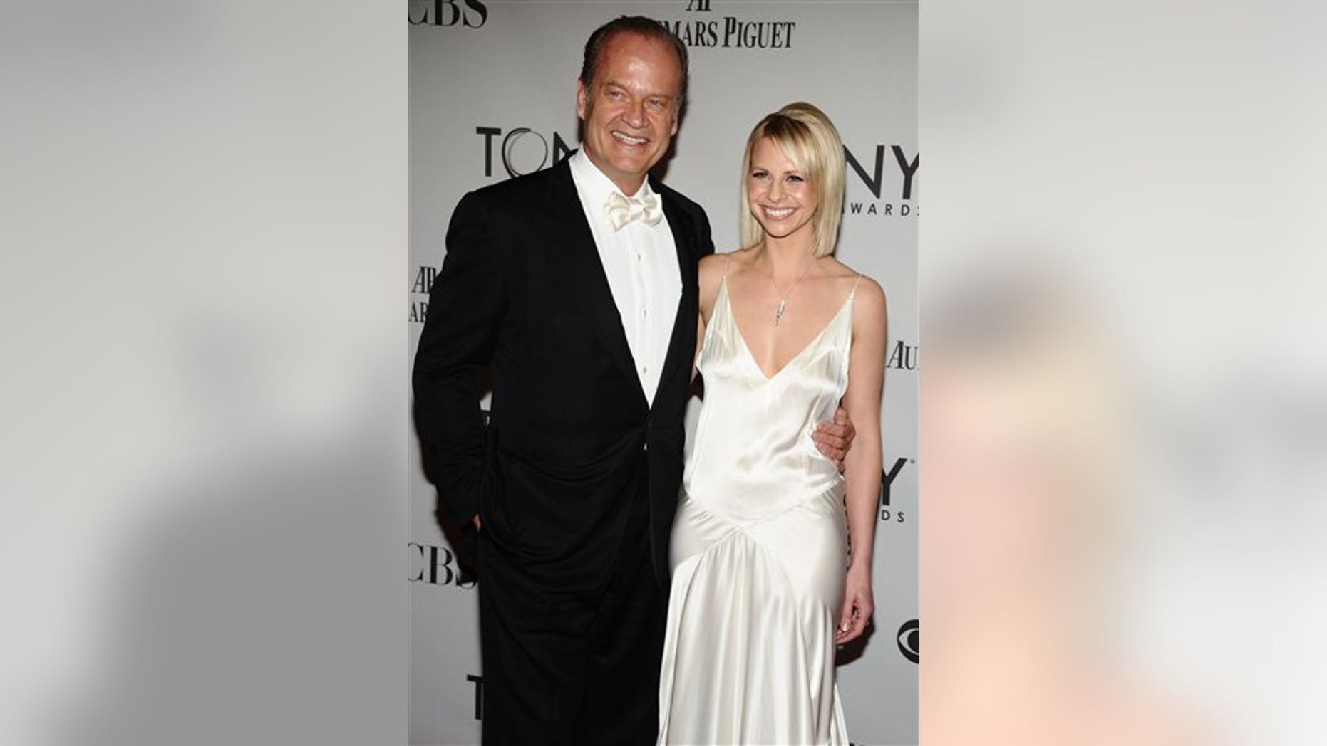 Kelsey Grammer, left, and Kayte Walsh arrive at the 65th Tony Awards, Sunday, June 12, 2011 in New York. (AP Photo/Charles Sykes)