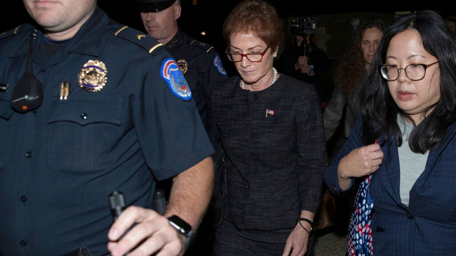 Former U.S. Ambassador to Ukraine Marie Yovanovitch, center, leaves Capitol Hill in Washington, after testifying before congressional committee members, Oct. 11, 2019. (Associated Press)