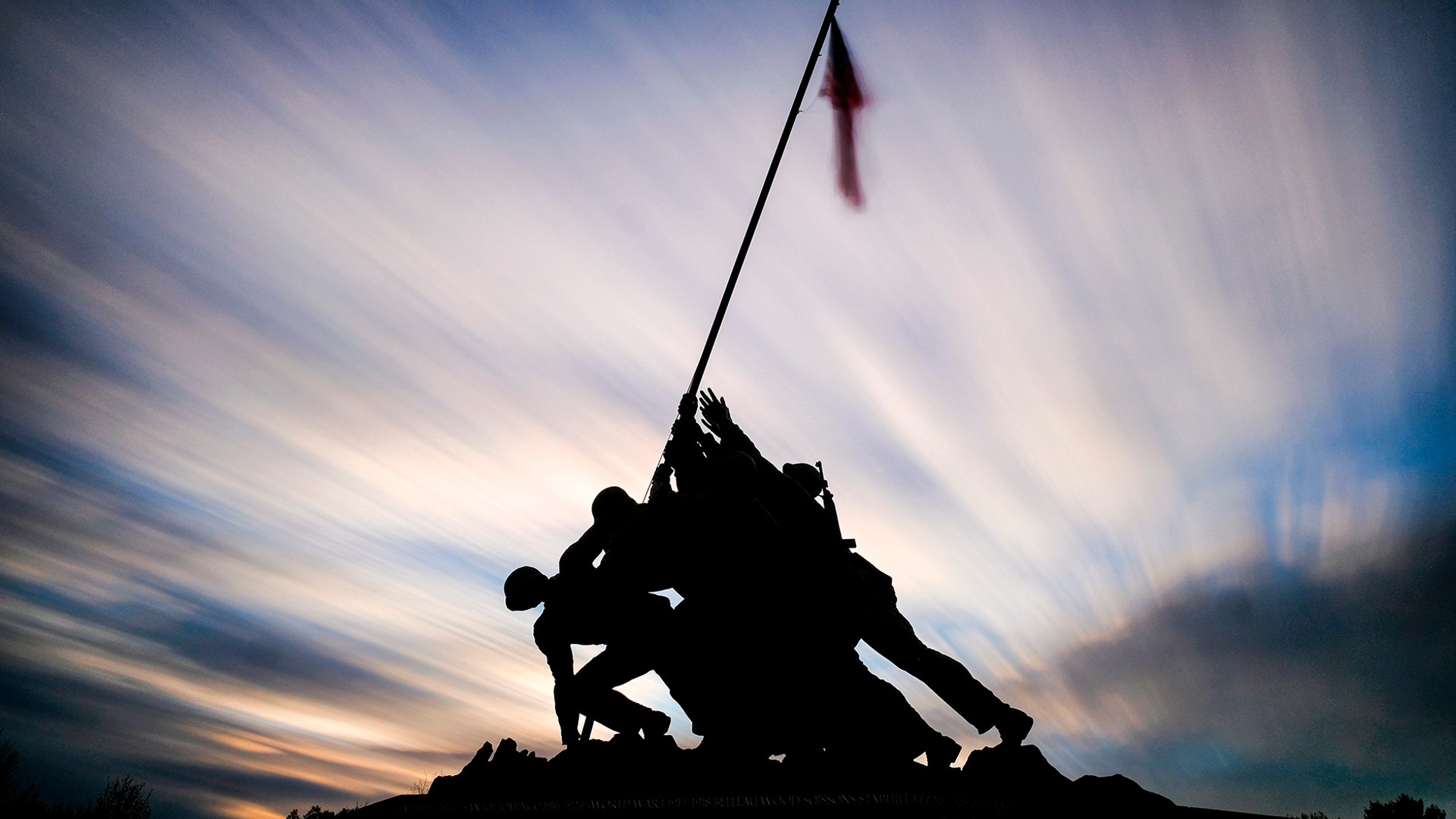 The sun sets behind the U.S. Marine Corps War Memorial in Arlington, Virginia, Nov. 10, 2019.