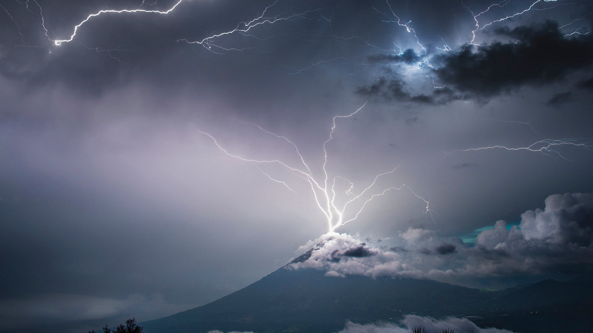 Lightning strikes the top of Volcán de Pacaya, an active volcano in Villa Canales, Guatemala, Nov 10, 2019.