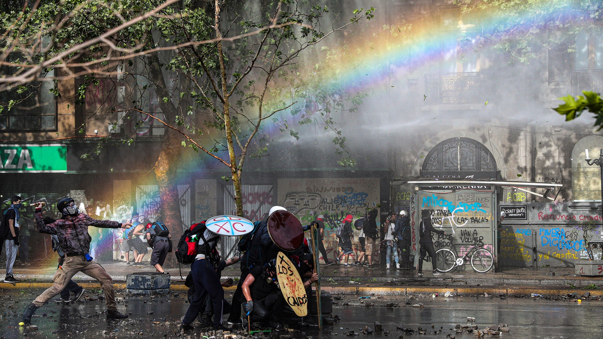 Anti-government protesters clash with the police during a protest in Santiago, Chile, Nov. 11, 2019.