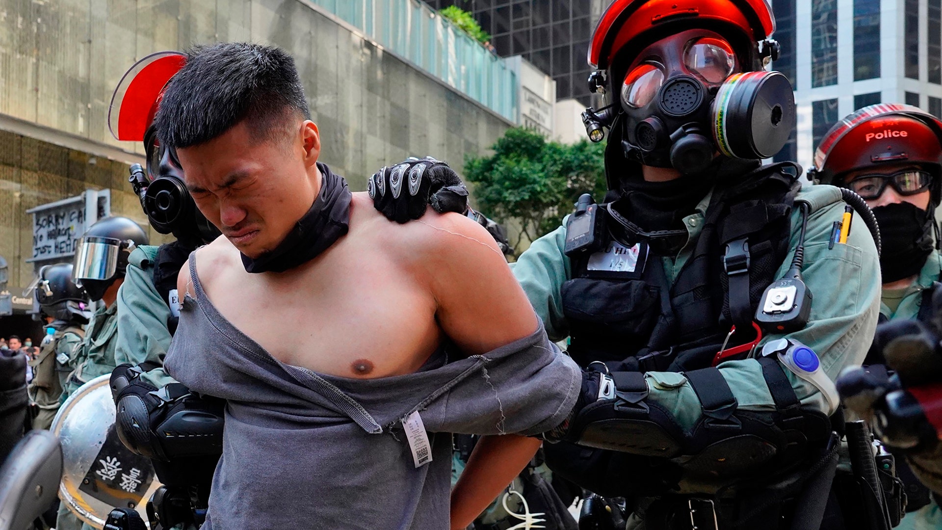 A protester is detained in the Central district of Hong Kong, Nov. 11, 2019.