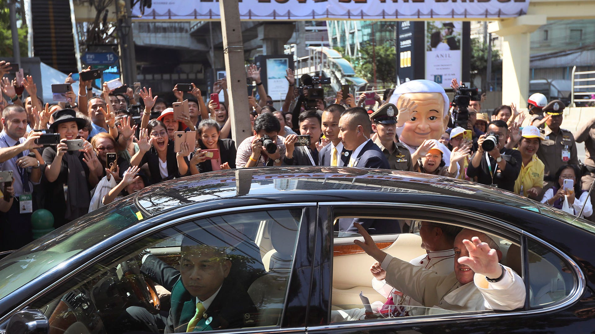 Pope Francis waves as he arrives at Apostolic Nunciature Embassy of the Holy See in Bangkok, Thailand, Nov. 20, 2019. 