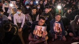 Hong Kong protesters carry Trump's 'Rocky' photo in Thanksgiving rally