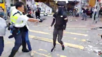 Hong Kong protester shot at close range, counterprotester set on fire in latest escalation of violence