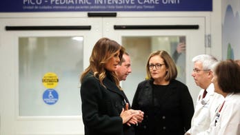 Protesters slam Melania Trump's visit to Boston hospital with cuddling program for babies born on drugs