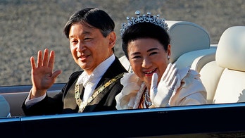 Japan emperor greets public in parade marking enthronement