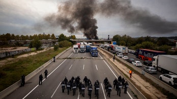 Catalan protesters storm Spain highway, snarling traffic and burning barricades