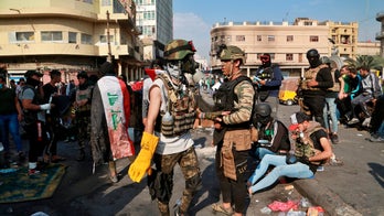 Iraq protesters burn Iranian Consulate as deadly unrest continues