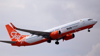 Plane erupts in flames with 196 people aboard, yet no one's hurt