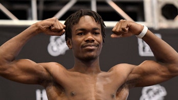 Evander Holyfield's son makes quick work of first professional boxing opponent