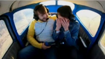 Kentucky man surprises girlfriend with enormous 'marry me' sign, plane ride proposal