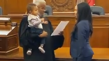 Video of judge holding baby during mom's swearing-in as lawyer goes viral