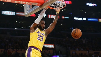 LeBron sets triple-double mark, Lakers hold off OKC 112-107