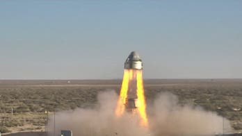 Space capsule soars in dramatic abort test