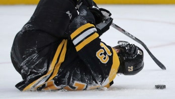 Boston Bruins' Charlie McAvoy smashes forehead on goalpost in scary incident