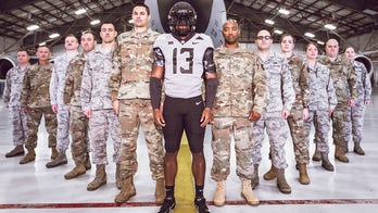 Oklahoma State football team honors veterans with military style uniforms