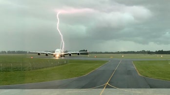 Lightning strikes near Emirates plane at New Zealand airport, 'epic' photo shows