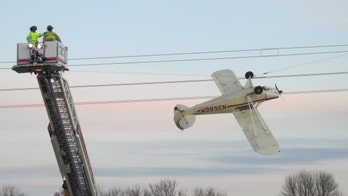 Minnesota pilot rescued after plane gets entangled in power lines, dangles in mid-air