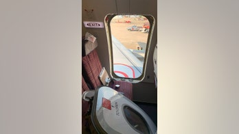 'Crazed' Thai Smile passenger rips plane's emergency exit door open before takeoff