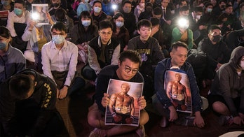 Hong Kong protesters carry Trump's 'Rocky' photo in Thanksgiving rally