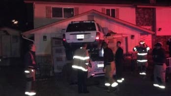 Washington car crash ends with 1 vehicle on top of the other: police