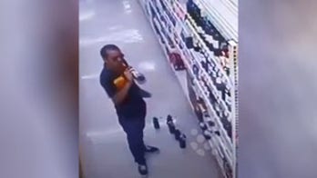 Wine thief caught sampling various bottles on grocery store security cameras