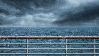 Cruise passengers appear to keep drinking while storm causes deck to flood