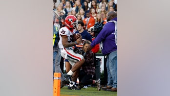 Photographer hospitalized after taking brutal hit during Georgia-Auburn game