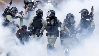 Hong Kong showdown: Protesters close in on trapped allies as police try to clear occupied university