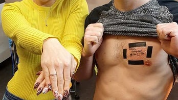Man proposes with 'Will you marry me?' chest tattoo