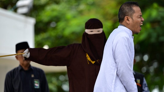 Indonesian man who helped write strict adultery law publicly flogged for affair