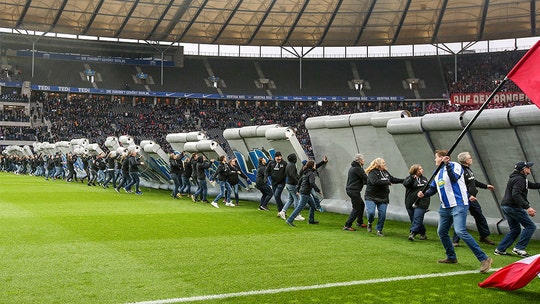 Fake 'Berlin Wall' dismantled by German soccer fans before match