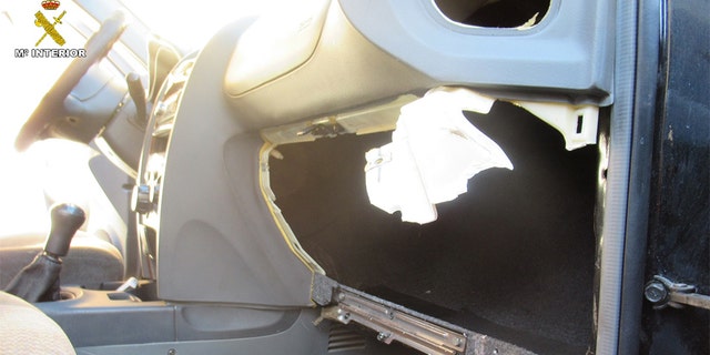 The ripped out remains of the glove compartment where one of the migrants was found.