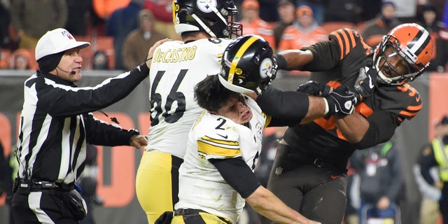Quarterback Mason Rudolph #2 of the Pittsburgh Steelers fights with defensive end Myles Garrett #95 of the Cleveland Browns during the second half at FirstEnergy Stadium on Nov. 14, 2019 in Cleveland, Ohio. The Browns defeated the Steelers 21-7. (Photo by Jason Miller/Getty Images)
