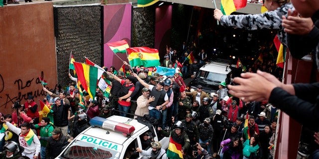 Luis Fernando Camacho, a Santa Cruz civic leader and major opposition figure, waves to the crowd while riding on a car, in La Paz, Bolivia November 10, 2019. REUTERS/Manuel Claure