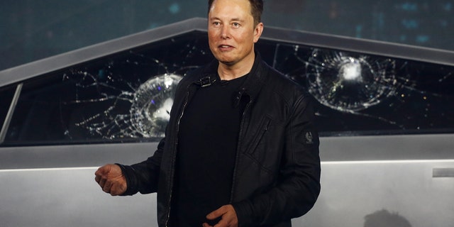 Tesla CEO Elon Musk introduces the Cybertruck at Tesla's design studio Thursday, Nov. 21, 2019, in Hawthorne, Calif. (AP Photo/Ringo H.W. Chiu)