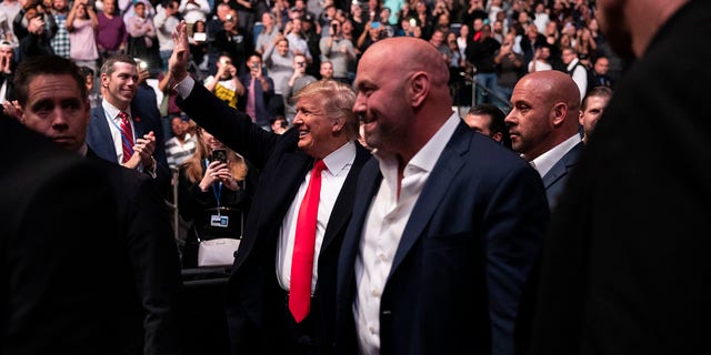 President Donald Trump and UFC president Dana White arrive at Madison Square Garden to attend the UFC 244 mixed martial arts fights, Saturday, Nov. 2, 2019, in New York. (Associated Press)