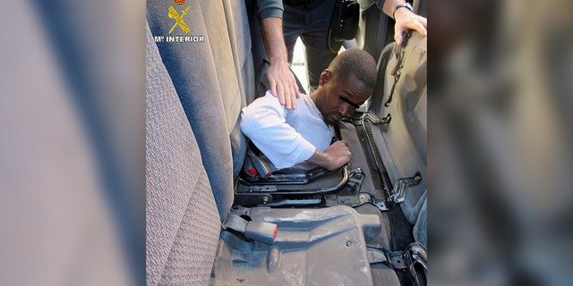One of the migrants, a 19-year-old, was found hiding under the rear car seats.