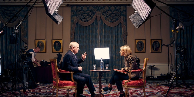Prince Andrew (L) and BBC Newsnight's Emily Maitlis (R) at Buckingham Palace.