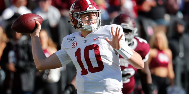 Alabama quarterback Mac Jones (10) rears back to pass downfield as a Mississippi State defender pursues during the second half of an NCAA college football game in Starkville, Miss., Saturday, Nov. 16, 2019. Alabama won 38-7. (AP Photo/Rogelio V. Solis)
