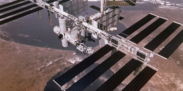 This digital concept shows the International Space Station passing above the Straits of Gibraltar and the Mediterranean Sea.