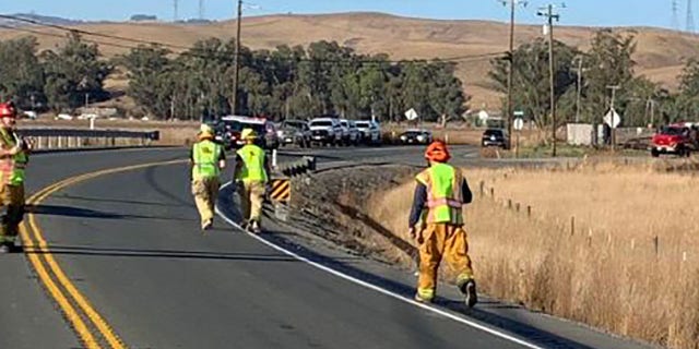 Investigators are seen in Sonoma County, Calif., at the scene of a fatal crash involving a state-owned firefighting vehicle, Friday, Nov. 1, 2019.(California Highway Patrol)
