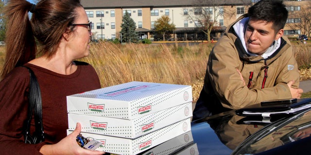 The student, who charged $17 to $20 per box of 12 doughnuts and had some customers pay $100 per run, was reportedly told his side gig was a liability for Krispy Kreme.