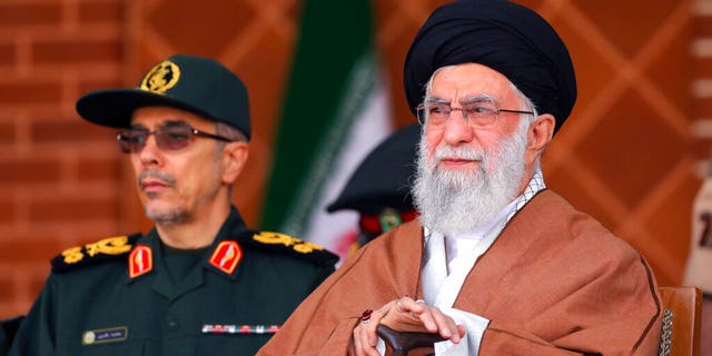 Supreme Leader Ayatollah Ali Khamenei reviews armed forces with Chief of the General Staff of the Armed Forces Gen. Mohammad Hossein Bagheri, during a graduation ceremony at Iran's Air Defense Academy, in Tehran, Iran, Wednesday, Oct. 30, 2019. 