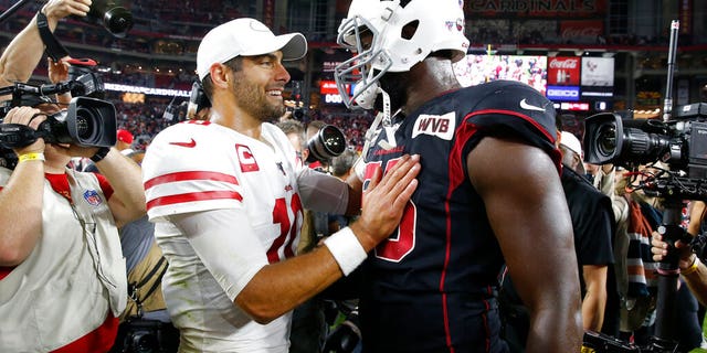 San Francisco 49ers quarterback Jimmy Garoppolo (10) greets Arizona Cardinals linebacker Chandler Jones (55) after an NFL football game, Thursday, Oct. 31, 2019, in Glendale, Ariz. The 49ers won 28-25.