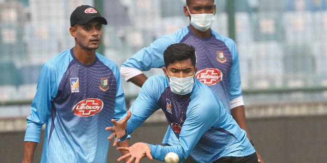Bangladesh cricket team members wear masks to protect themselves from air pollution as they practice at the nets ahead of their first T20 international cricket match against India in New Delhi, India, Friday, Nov. 1, 2019.